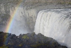 Picture taken by The Half Hermit in Iceland on August 2015. It portrays the Dettifoss waterfall with a segment of a rainbow and a human figure. This one gets acroos perfectly the idea of how powerful the waterfall is. In fact Dettiffoss is largest waterfall in Europe in term of water flow rate.